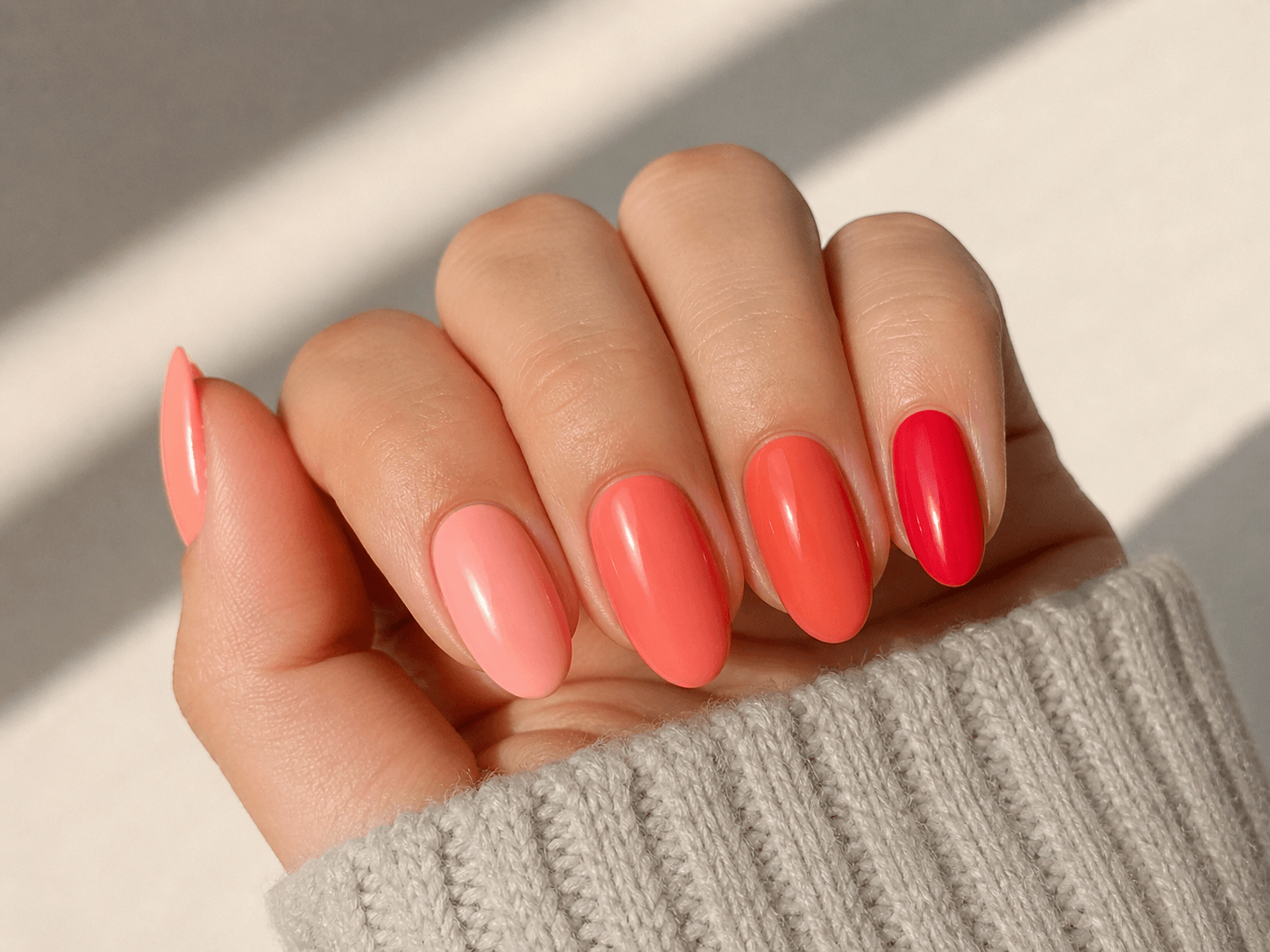 Coral nails close-up showing different shades