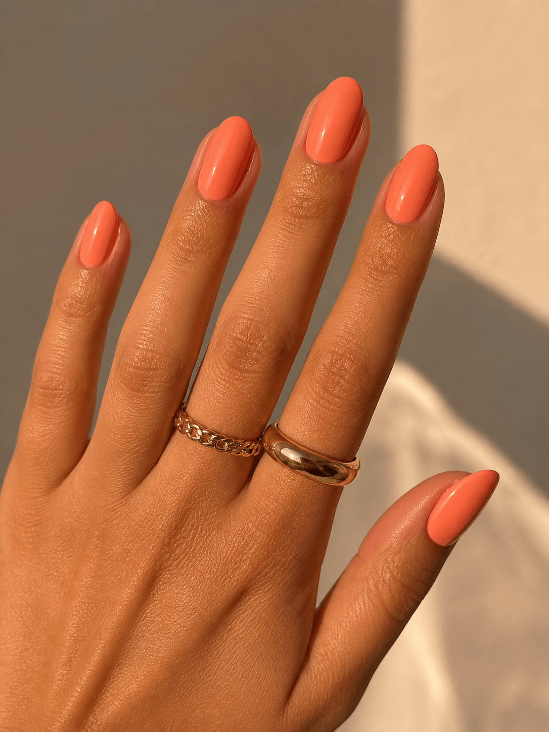 Warm coral colours on medium short nails